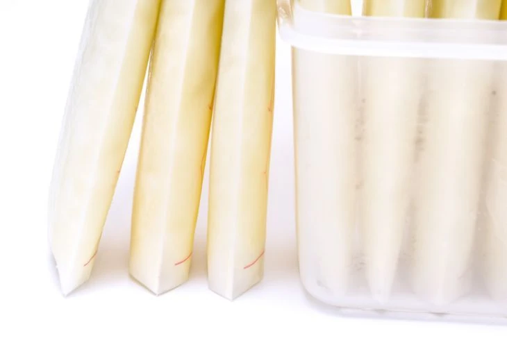 Frozen breast milk storage bags in a container