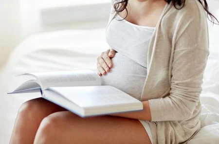 Pregnant Woman Reading a Book
