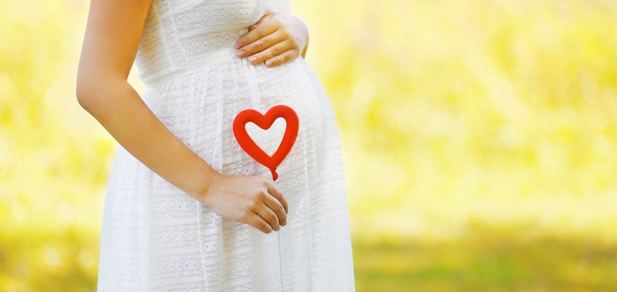 Pregnant mom holding a heart