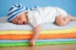 Sleeping baby wearing overnight diapers