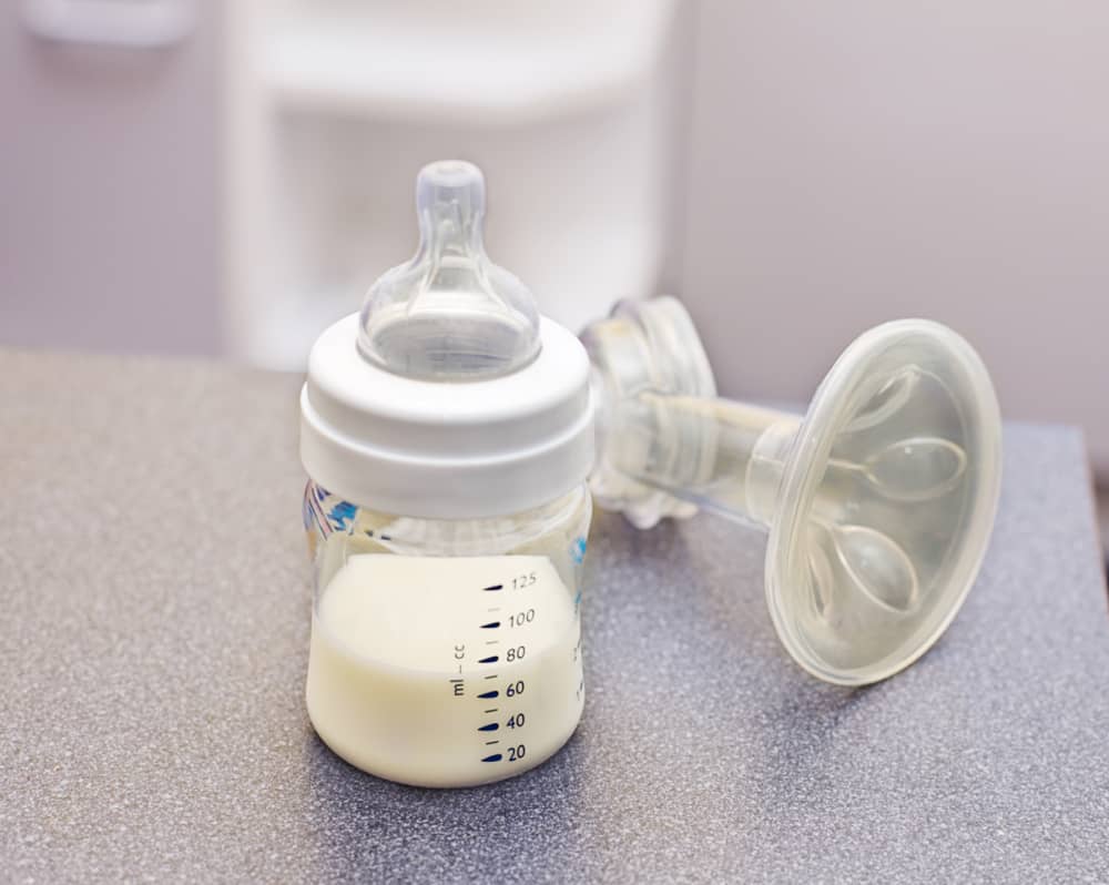 Bottle of expressed breast milk on the counter