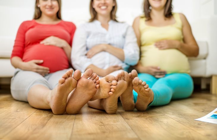 Pregnant women with swollen feet in need of pregnancy shoes