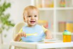 Young baby sitting in a high chair