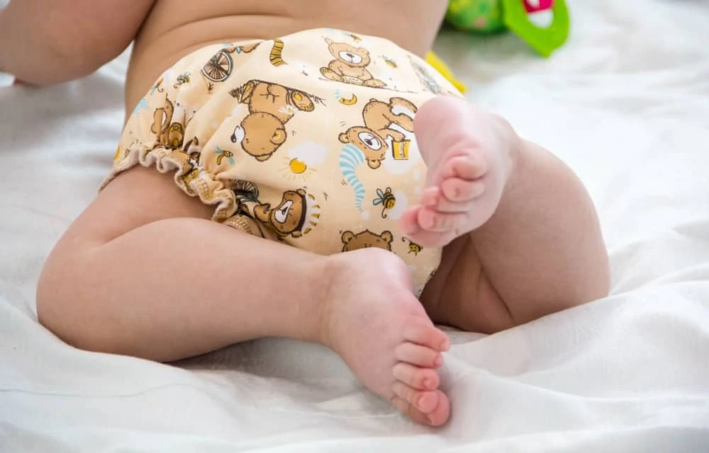Baby wearing cute cloth diapers