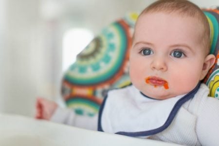 Baby eating pureed baby food