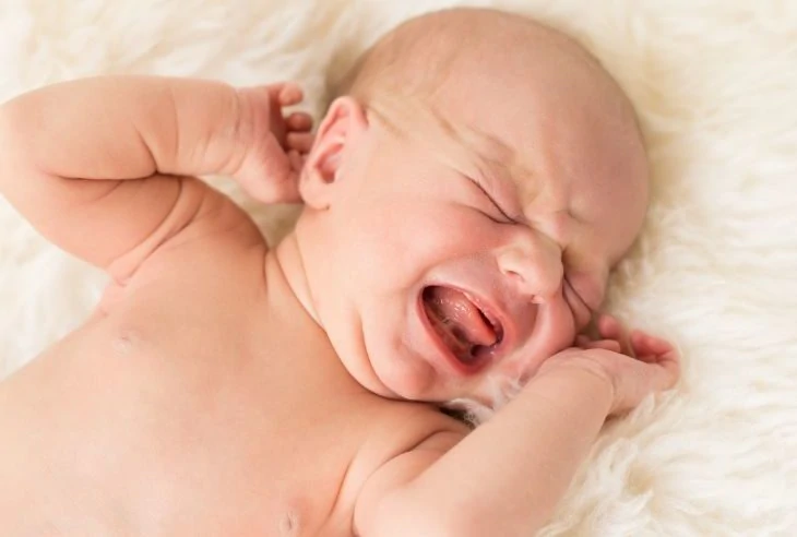 Constipated newborn baby crying