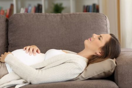 Pregnant women lying down feeling dizzy