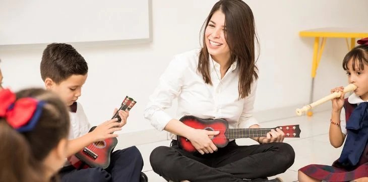 Kids playing music instruments in school