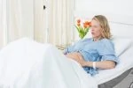 Pregnant woman laying in hospital bed