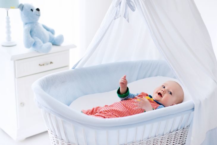 Baby lying in a bassinet