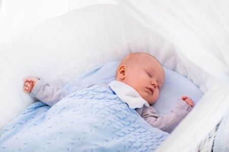 Baby sleeping in a bassinet