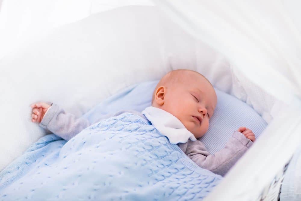 baby rolling over in bassinet