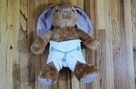Stuffed rabbit wearing a cloth diaper
