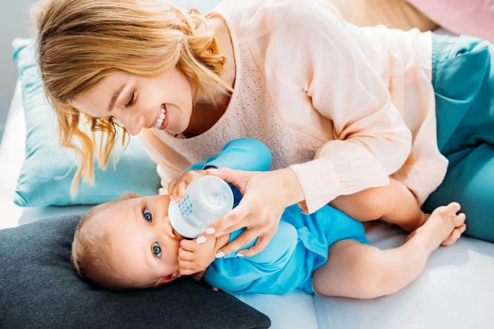 Mom bottle feeding her baby