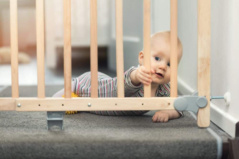 best baby gate for top of stairs with banister and wall