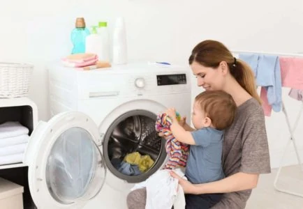Mom and baby doing laundry