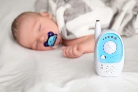 Baby sleeping with a baby monitor