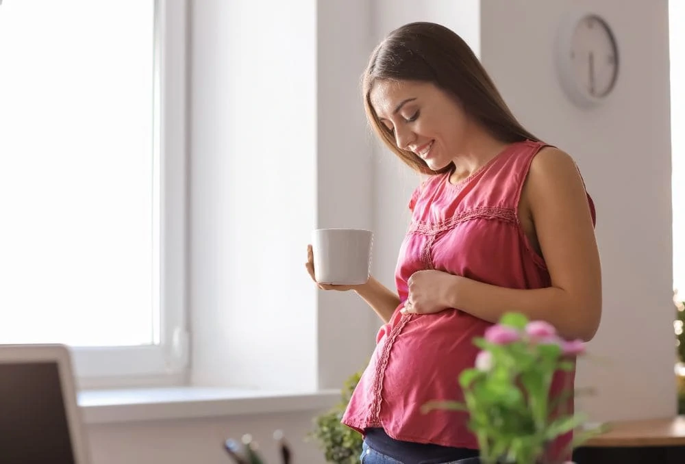 Pregnant woman drinking tea