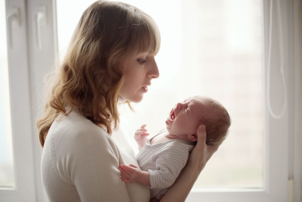 Newborn baby best sale fussy while sleeping