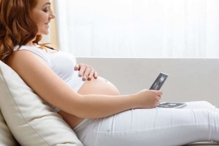 Pregnant woman looking at her ultrasound