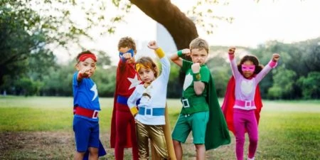 Group of little kids in superhero costumes