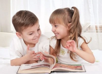 4-5 year old girl taking a deep breath on white background Stock