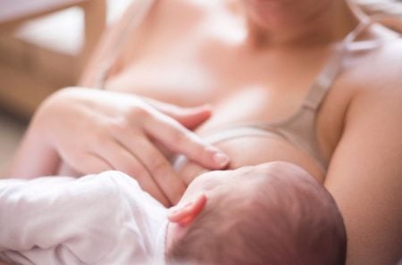 Mother breastfeeding her baby with a nursing bra