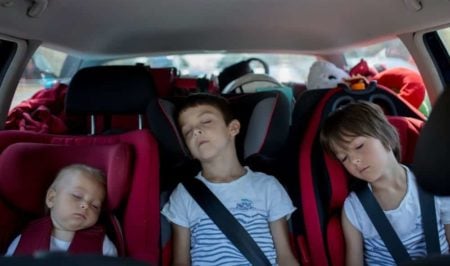 3 Siblings sleeping in their car seats