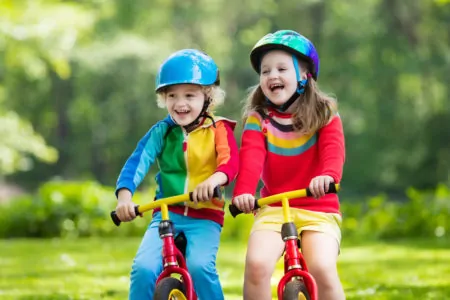 Kids riding bikes wearing best bike helmets