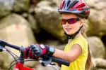 Little girl wearing biking gloves