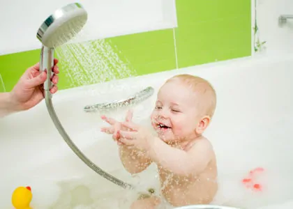 Bathing a baby in a tub