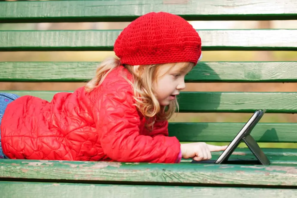 Young girl playing with ipad