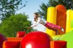Girl playing in a bounce house