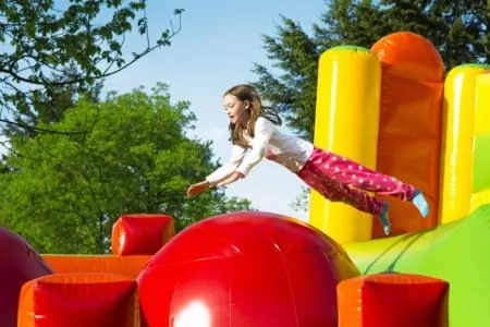 Girl playing in a bounce house