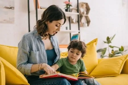 Mom reading to her toddler son