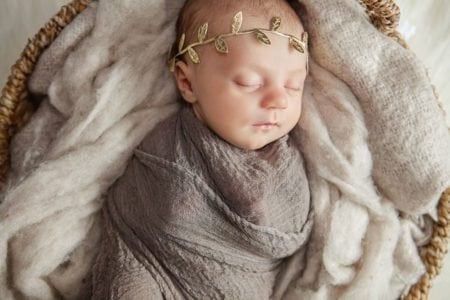 Newborn dressed as a greek goddess