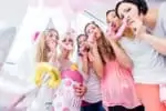 Group of women on baby shower party having fun with songs