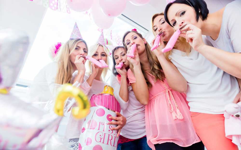 Group of women on baby shower party having fun with songs
