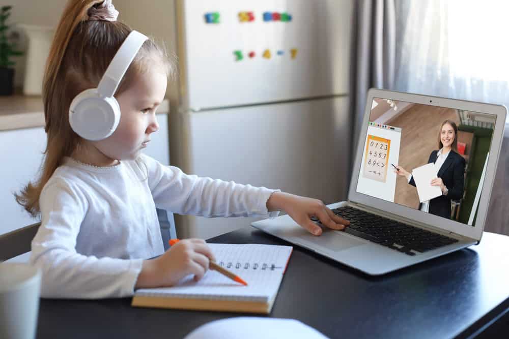 Young girl using a chromebook for online distance learning