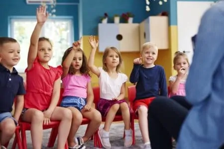 Group of preschool children playing never have I ever