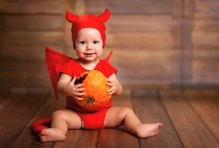 Cute baby in devil costume