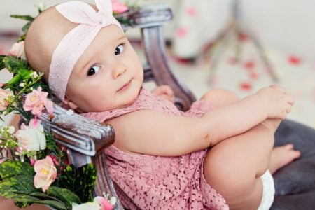 baby girl wearing a beautiful dress