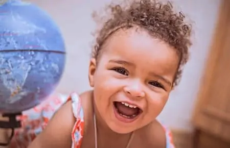 Gorgeous happy mixed race baby girl