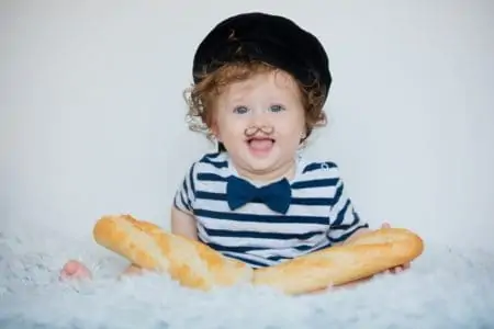 Cute little french boy with baguette