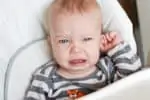 Cute little boy crying with ear infection