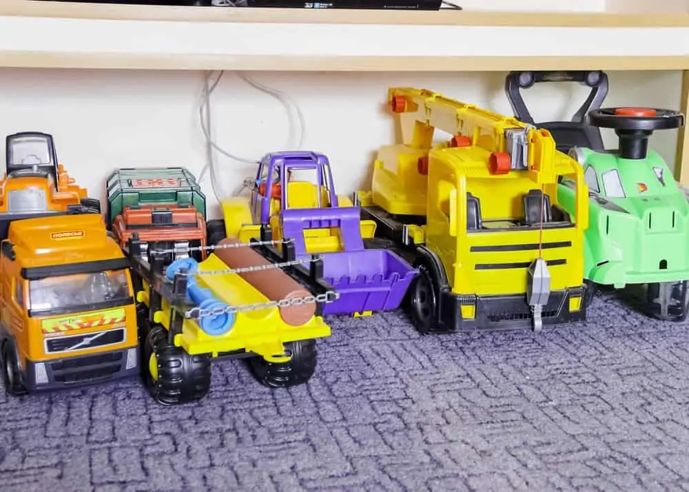 Multi-colored remote control toys on a carpet
