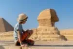 Little boy looking at the Great Sphinx of Giza