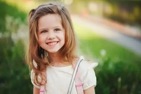 Smiling little girl spending time outdoors