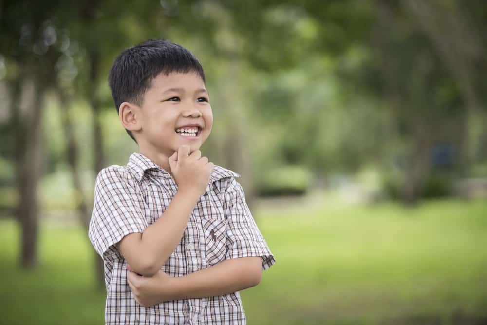 Happy Thai boy playing in the park