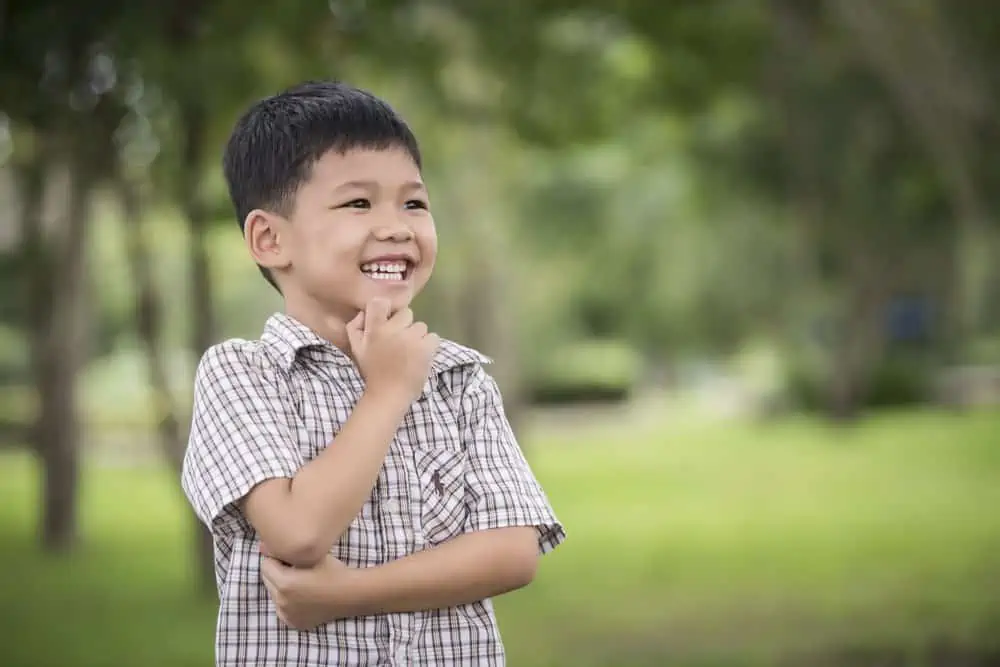 Happy Thai boy playing in the park
